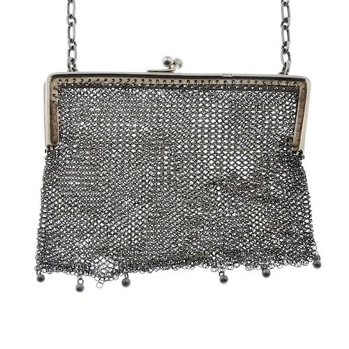 A silver mesh bag. The square-edged frame to the clip clasp, mesh bag with bead drops and chain hand