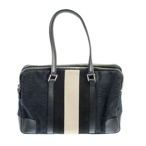 GUCCI - a monogram canvas stripe tote. Designed with a navy blue GG monogram canvas exterior with a