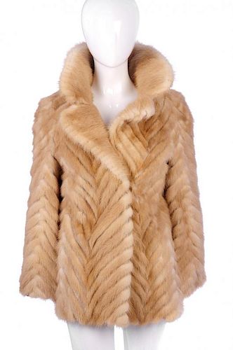 A chevron striped palomino mink jacket. Designed with a full mink notched lapel collar, hook and eye