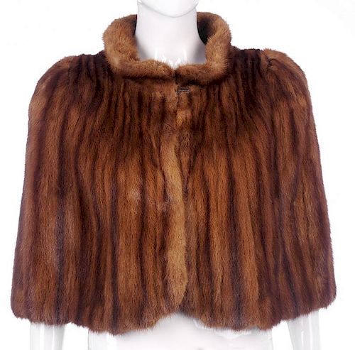 A 1940s wild mink cape. Designed with a short Peter Pan collar, a single hook and eye fastening, fit