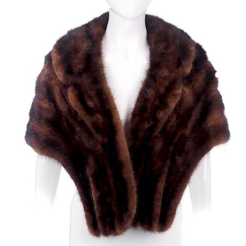 A ranch mink stole. Designed with a notched lapel collar, two outer pockets and an inner patch pocke