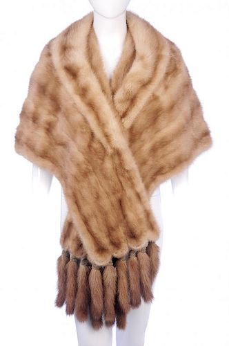 A dawn pastel mink cape-stole with detachable tails. Featuring a lapel collar, a single hook and eye
