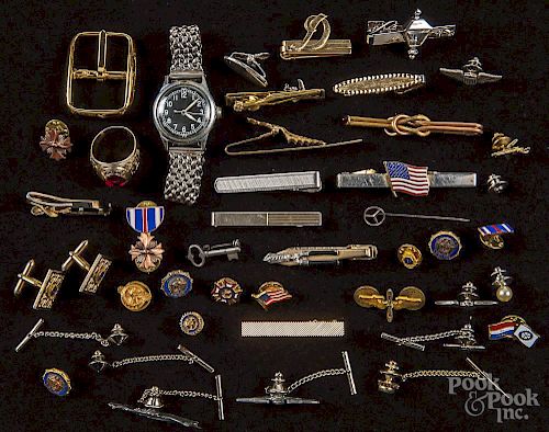 Tie clips and cufflinks, many with fraternal organization symbols or military insignia.
