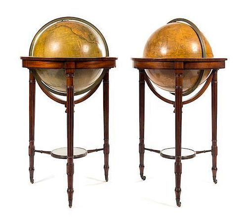 A Pair of Regency Mahogany Celestial and Terrestrial Library Globes Height 44 x diameter of globes 18 inches.