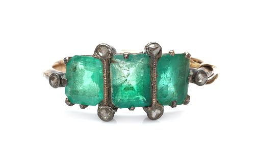 A gold and silver, emerald and diamond ring,