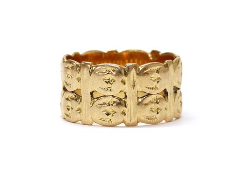 A gold two row pierced band ring,