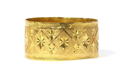 An Indian high carat gold bangle,