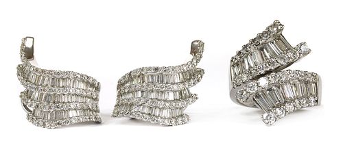 A white gold baguette cut diamond ring and earrings suite,