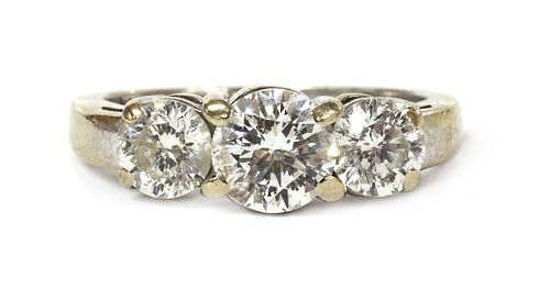 A white gold three stone diamond ring,