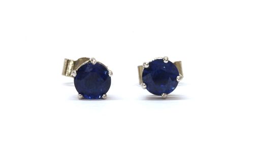 A pair of 18ct white gold single stone sapphire stud earrings,
