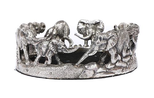 A silver elephant wine coaster, by Patrick Mavros,