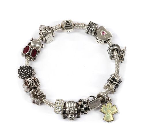 A sterling silver Pandora bracelet,