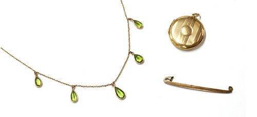 A gold peridot fringe necklace,