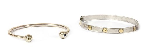 A gentlemen's silver and gold oval hinged bangle,
