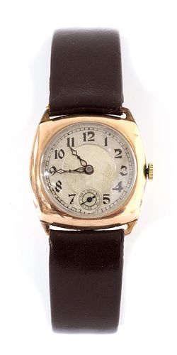 A 9ct gold cushion shaped mechanical strap watch,