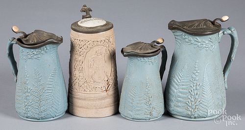 Three stoneware pitchers and a German stein