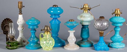 Nine fluid and table lamps, 19th/20th c.