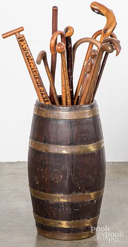 Collection of carved canes and brass bound barrel