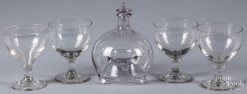 Four colorless glass goblets and a flycatcher
