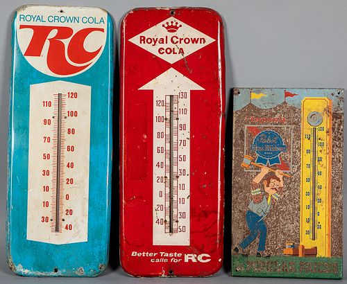 Three tin advertising thermometers
