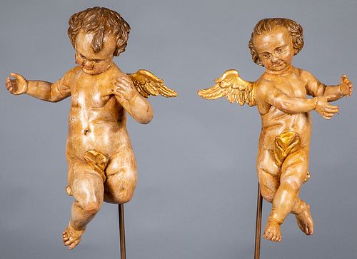 Continental carved and painted cherub figures