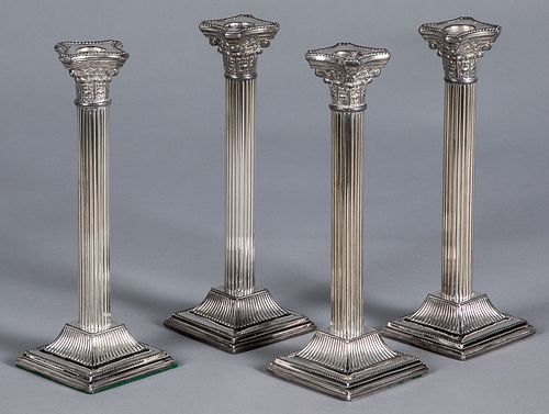 Set of four silver plated candlesticks, 10" h.