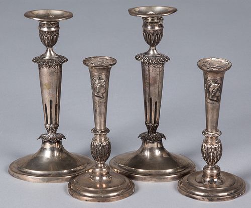 Two pairs of Continental silver candlesticks