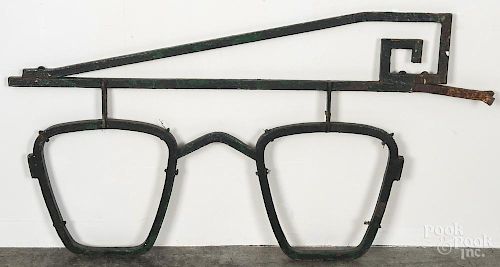 Painted cast iron optician's trade sign, 20th c., 23 1/2'' h., 43'' w. Provenance: DeHoogh Gallery