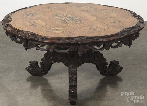 Victorian mahogany center table with an inlaid top with animal decoration, 18'' h., 35'' w.