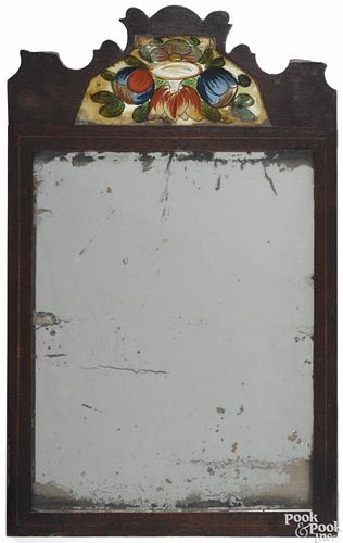 English mahogany courting mirror, 18th c., with an églomisé panel inset crest, 15 1/2'' x 9 1/2''.