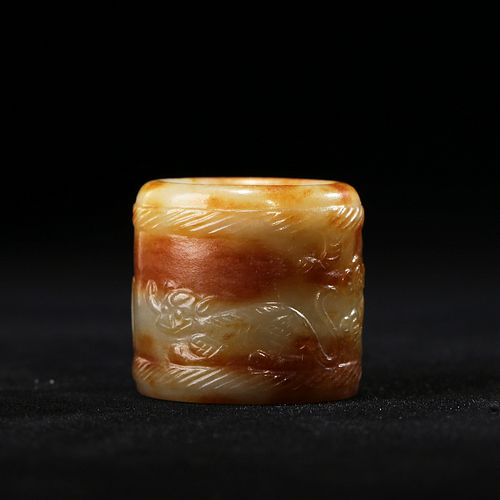 A CARVED JADE THUMB RING