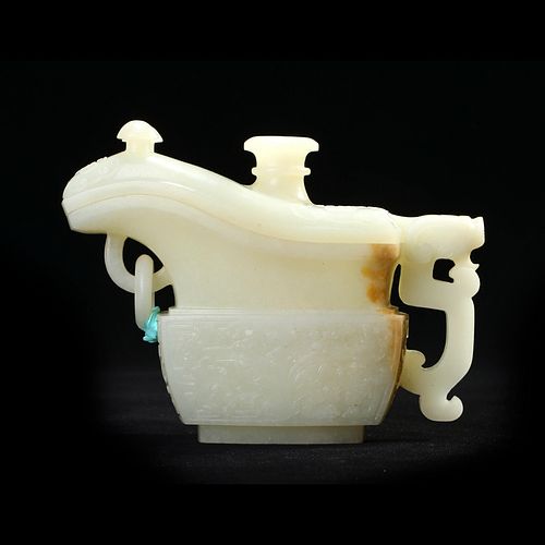 A WHITE JADE ARCHAISTIC 'DRAGONS' JADE VESSEL