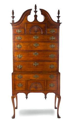 * An American Cherry Highboy, NEW ENGLAND, 18TH CENTURY WITH ALTERATION, Height 87 3/4 x width 39 x depth 21 1/2 inches.