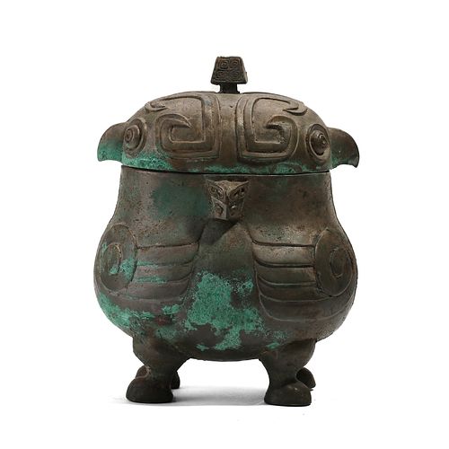 A BRONZE ANIMAL-FORMED VESSEL WITH FOUR LEGS