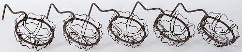 Two sets of painted iron and wire hanging plant stands, eleven pieces total, 11 1/2'' l., 5 1/2'' w.