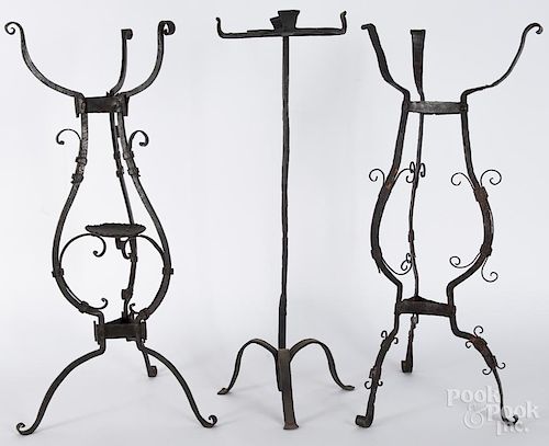 Three wrought iron stands, to include a pair of Continental tripod basin stands, 17th/18th c., 29'' h.