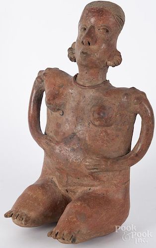 Pre-Columbian pottery figure of a seated woman, Nayarit or Jalisco, with red glaze and a hollow head