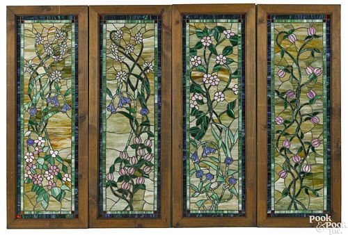 Set of four slag glass panels, ca. 1970, with floral decoration, 49 1/2'' x 15 1/2''.