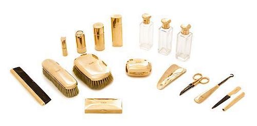A Victorian 14 Karat Yellow Gold Mounted Dressing Set, Cartier, Paris, Late 19th Century, comprising bottles, brushes, boxes, a