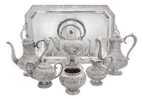 A Japanese Silver Tea Service, 19th/20th Century, comprising a kettle on lampstand, two coffee pots, a two-handled lidded sugar