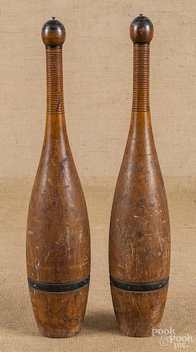 Pair of painted wood Indian clubs, 19th c.