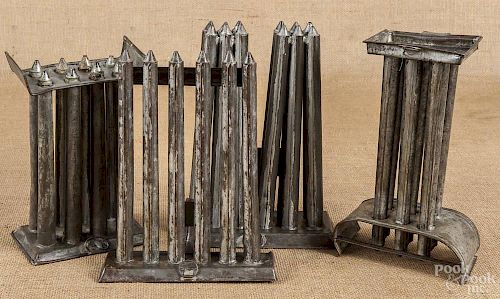 Four tin candle molds, 19th c.
