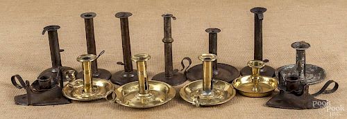 Group of eleven brass and tin candlesticks