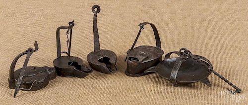 Four wrought iron Betty lamps, 19th c.
