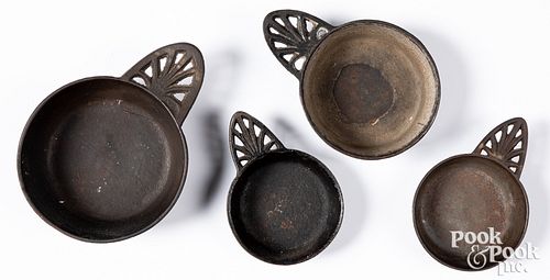 Four cast iron porringers, 19th c.