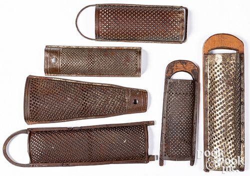 Six antique tin graters, longest - 17".