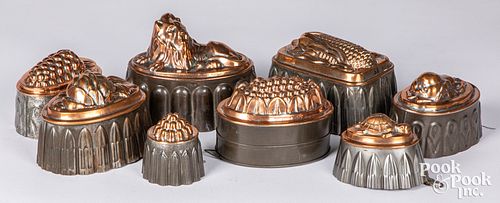 Eight antique tin and copper food molds