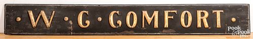 Carved and painted W.C. Comfort trade sign