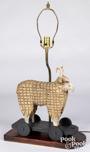 Koosed carved and painted ram table lamp, 15" h.