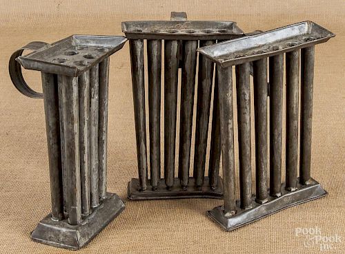 Three tin candle molds, 19th c.